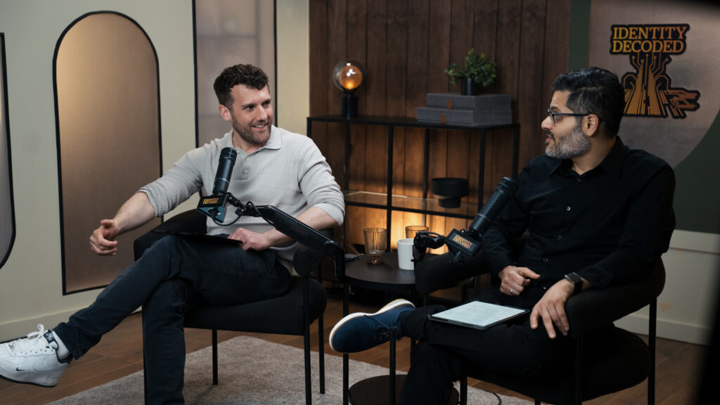 Podcast hosts talking during a recording session